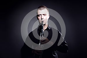 Clarinet player classical musician portrait. Clarinetist playing woodwind