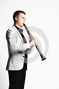 Clarinet player classical musician on white.