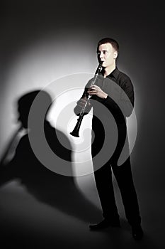 Clarinet player. Portrait of classical musician playing