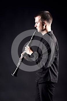 Clarinet player profile. Musician playing woodwind