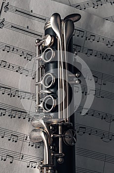 clarinet with sheet music,close shot of clarinet with sheet music.