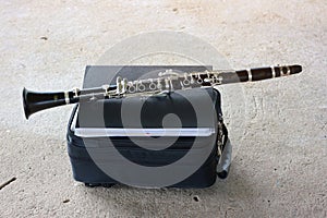 the clarinet is a wooden instrument with a box and music notes.