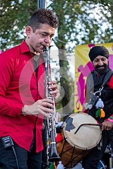 Clarinetist Merlin Shepherd playing at an annual concert of Jewish Klezmer music in Regent`s Park in London UK.