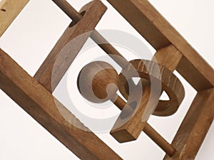 A clasic wooden puzzle on a white background