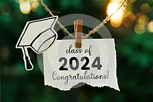 Class of 2024 on a note paper hanging on rope