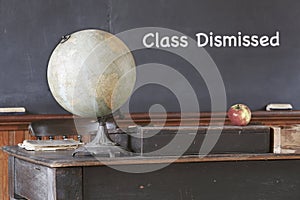 Class Dismissed Message on Old Chalkboard photo