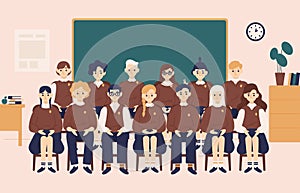 Class group portrait. Smiling girls and boys dressed in school uniform or pupils sitting in classroom against chalkboard