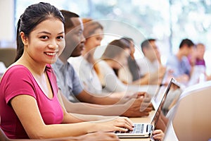 Class Of University Students Using Laptops In Lecture