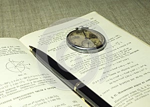 Classbook, pen and old watches