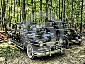 Classic 1946 Plymouth Special Deluxe and a 1929 Ford Model A.