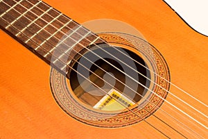 Classic acoustic guitar on white background view