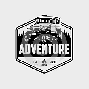 Classic adventure overland vehicle in outdoor emblem logo