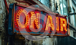 Classic ON AIR illuminated sign in bold red letters indicating live broadcast or recording in progress in a radio