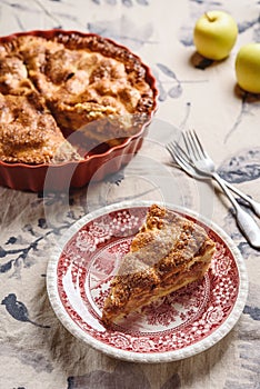 Classic American apple pie on linen tablecloth