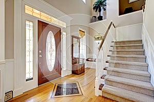 Classic AMerican home entrance interior with staircase.
