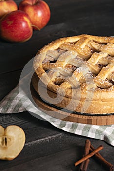 Classic apple pie on a kitchen table. Holidays traditional dessert. Homemade pastry.