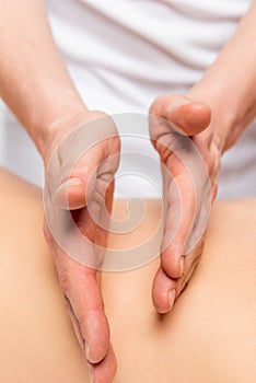 Classic back massage closeup, masseur`s hands