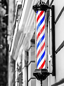 A classic barber logo. Barber shop pole. Logo of the barbershop, symbol. Barbershop pole, retro. Old fashioned vintage