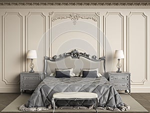 Classic bedroom furniture in classic interior.Walls with mouldings,ornated cornice