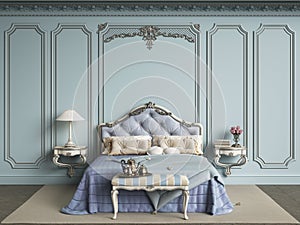 Classic bedroom furniture in classic interior.Walls with mouldings,ornated cornice