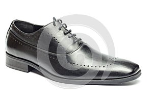 Classic black leather men`s shoe isolated on white background.