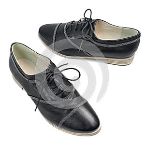 Classic black leather shoes with laces on white background