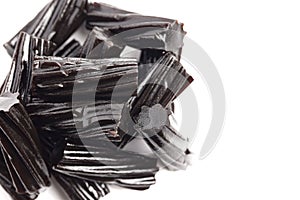 Classic Black Licorice Pieces Isolated on a White Background