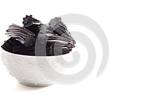 Classic Black Licorice Pieces Isolated on a White Background