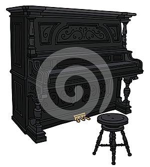 The classic black pianino with a chair