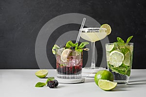 Classic and blackberry mojito cocktaisl with lime.