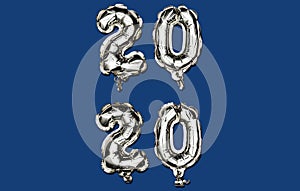 Classic Blue Happy New Year 2020. Vertical composition of number 2020 silver foil balloons on trendy background.