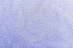 Classic blue knitted fabric wool texture for background. Close up of blue knitted material pattern for design. Blue warm sweater