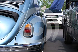 A classic, blue Volkswagen Beetle car