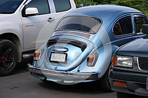 A classic, blue Volkswagen Beetle car