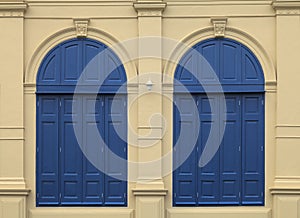 Classic blue windows on brown cream wall