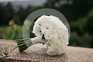 Classic bouquet of roses on the wedding.