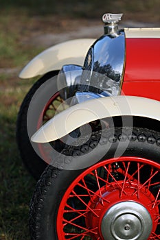 Classic British car wheel, headlight and grille photo