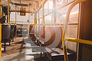 Classic brown leather seats in old city bus.