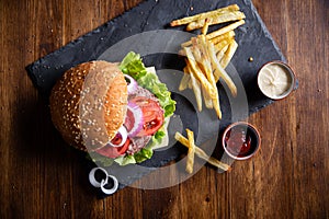 Classic burger with fries and onions