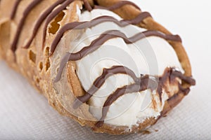 Classic Cannoli filled with sweet cream and chocolate drizzles