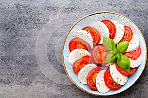 Classic caprese salad. Mozzarella tomatoes and Basilikum.