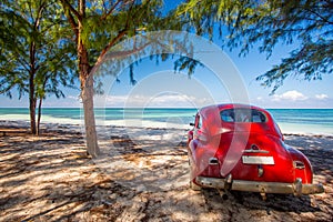 Classic car on a beach in Cuba