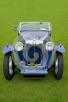 Classic car, blue soft top.
