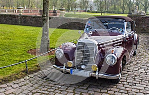 Classic car in castle courtyard