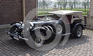 Classic car in castle courtyard