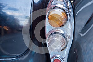Classic car with close-up on back headlights lamp of retro car v