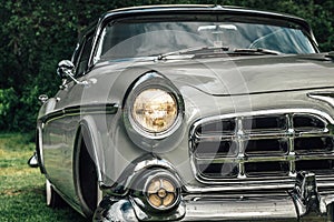 Classic car from the early fifties with large chromed grille