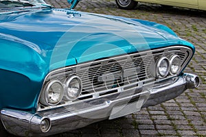 Classic car front view with headlights and chrome