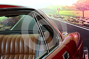 Classic  car. Red car. View of the rear seat in brown leather. Close up. High-end car. Collectable. Vehicle. Conveyance. Rea