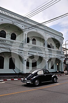 Classic car and Sino-Portugese building